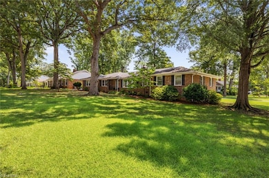 Situated on a large corner lot with mature landscaping