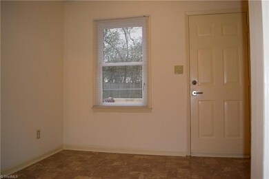 Rear door to patio, space could be a dining room or second family room