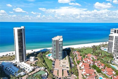 Bird's eye view with a view of the beach and a wat