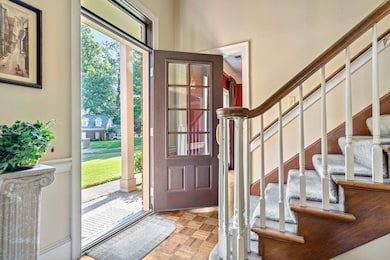 Entrance foyer with light parquet floors