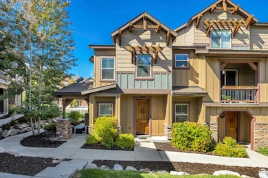 Craftsman inspired home with board and batten siding and stone siding