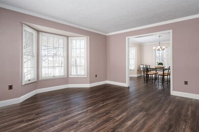 Large living room with bay window.