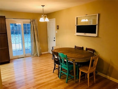 Dining area that leads to the newer back sliding d