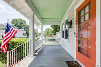 Full country porch with porch swing.