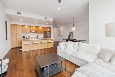 Living room featuring dark wood finished floors, 