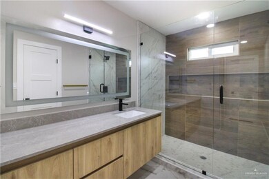 Bathroom with vanity and a shower stall