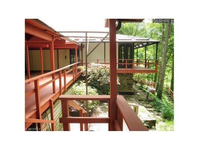 This multi-level home has decking and patios surro