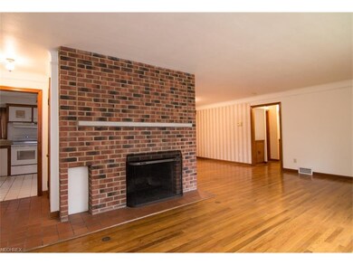 The living room is spacious and features a floor t