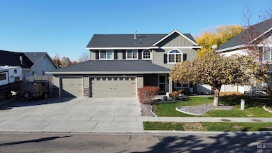 Traditional-style house with a front lawn, board and batten siding, driveway, a garage, and a porch