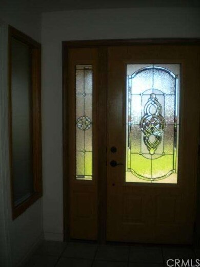 Front door from inside home.  To the left is an of