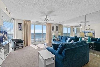 Living room with a water view, visible vents, a we