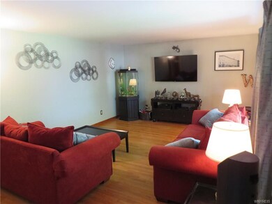 Large living room features hardwood floors and pic