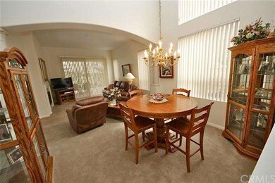 Formal dining and archway to the formal living roo