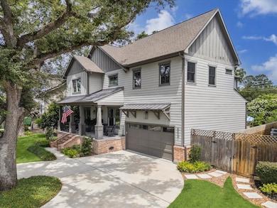 Beautiful curb appeal with towering trees, spaciou