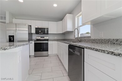 Kitchen with a sink, stainless steel appliances, m