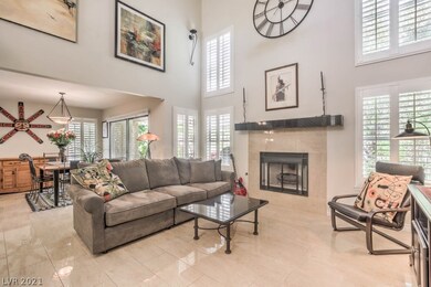 Living room boasts high ceilings and loads of wind