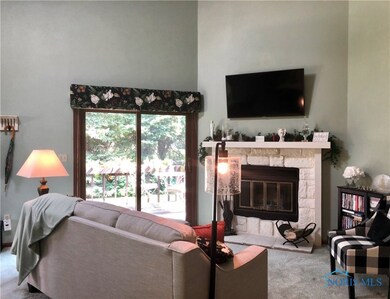 Cozy living room with woodburning fireplace.
