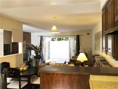 KITCHEN OPENS TO DINING AREA AND LIVING ROOM WITH 