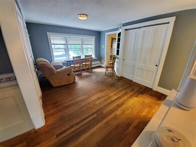 Dining room with hard wood floors.