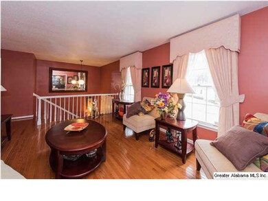 3rd view of sunny living room and split foyer