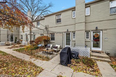 Rear view of house featuring a chimney, outdoor lounge area, a patio, entry steps, and brick