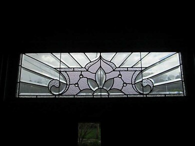 Living Room. A close up on the transom window.  Ma