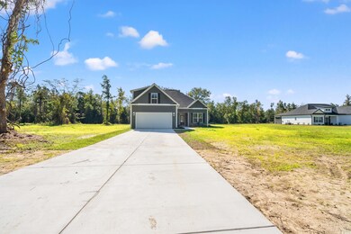 View of front of property featuring a garage and a