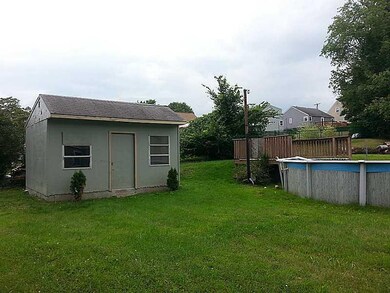 Exterior Back. Pool needs to be fixed, or the sell