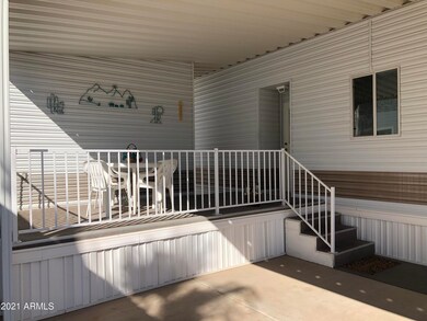 DECK IN FRONT OF CARPORT AREA