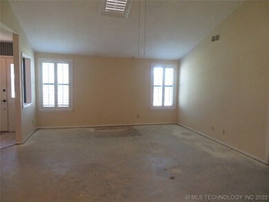 Large living room with skylight.  Plantation Shutt