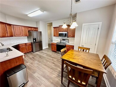 Kitchen with a sink, stainless steel appliances, t