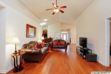 Opposite view of the family room. Check out those gleaming hardwood floors and soaring ceiling!