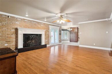 Den with wood burning fireplace