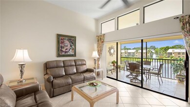 Living room featuring light tile patterned floors, a towering ceiling, and a ceiling fan