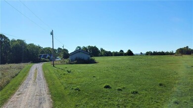 Driveway to home in back with...
