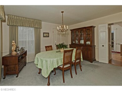 The dining room leads to both the kitchen and util