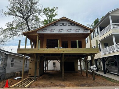 View of front facade featuring a carport