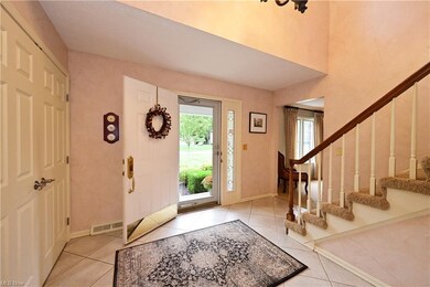 Large two story foyer with ceramic tile flooring