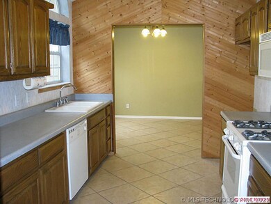 Beautiful kitchen with wood on two walls and beaut