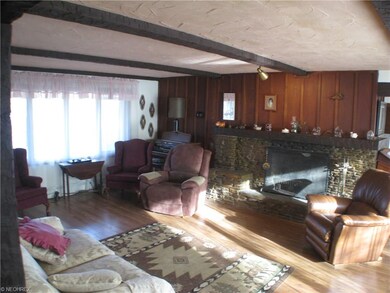 Living room with front yard, back yard and creek v