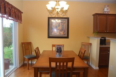 Beautiful hardwood floors flow from dining room in