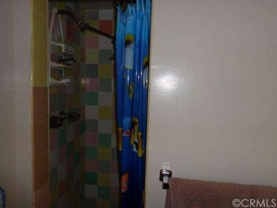 Beautifully tiled bathroom shower with unique sink