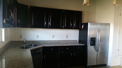 Granite cntops & dark wood cabinets