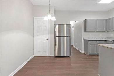 Kitchen featuring an inviting chandelier, hanging 