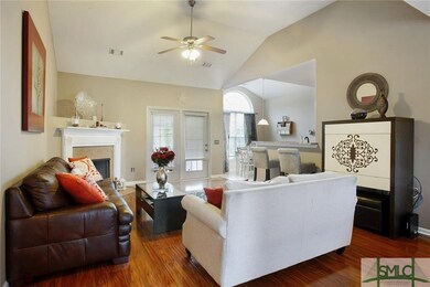 Great Room with Fireplace and Gleaming Floors