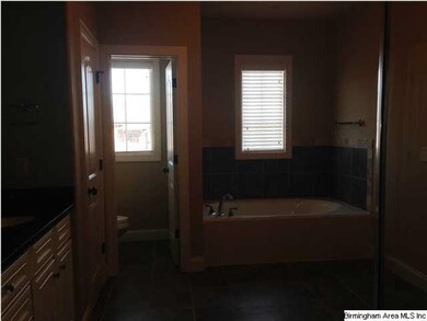 JETTED TUB AND WALKIN CLOSET.