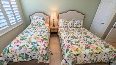 Guest bedroom with a twin bed and a full bed
