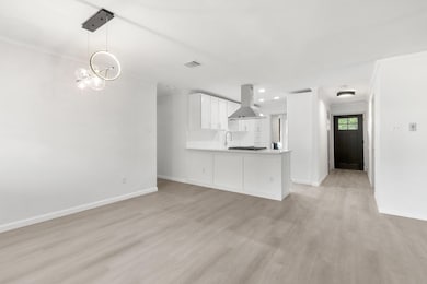 Unfurnished living room with light wood-style flo