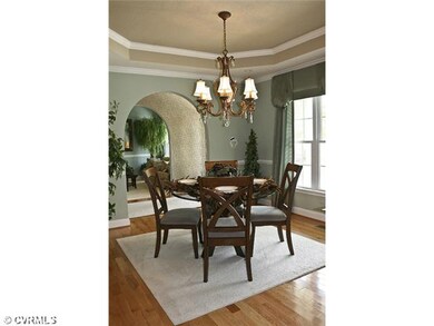 Dining Room - With wood floors and tray ceiling