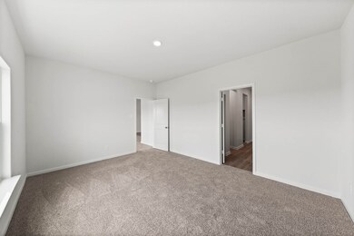 Unfurnished bedroom featuring carpet flooring and recessed lighting